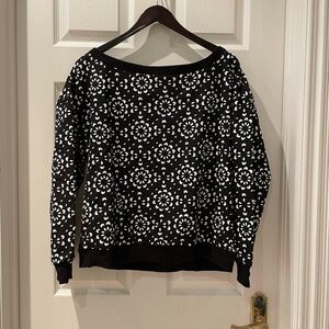Woman’s patterned sweater